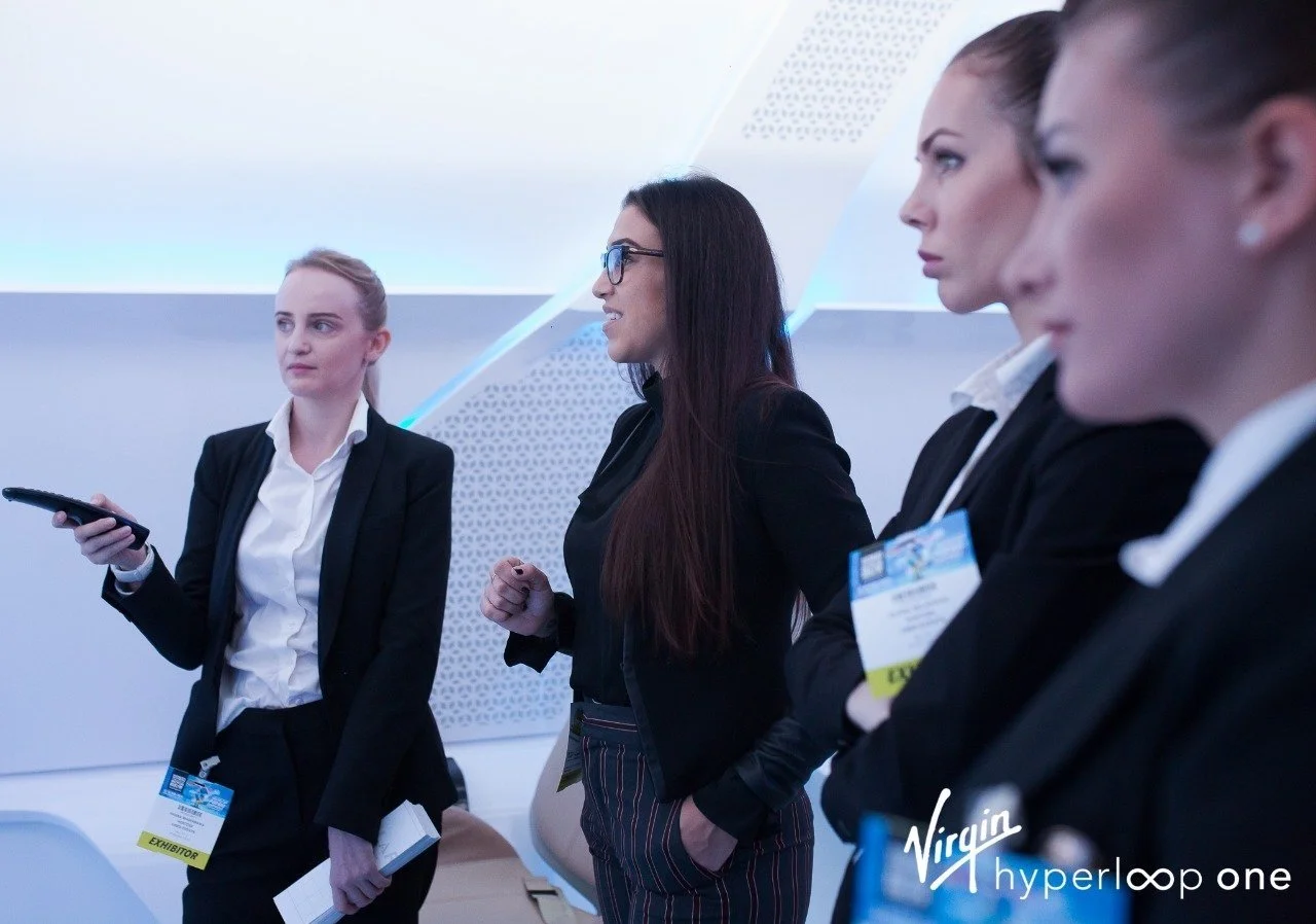 Sarah Iskander briefing a delegation on the Virgin Hyperloop exhibition floor